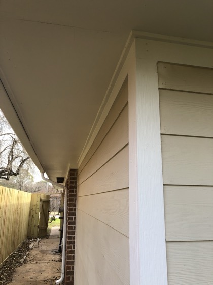 Clean new fiber-cement siding with crisp white trim — AttarCo Homes roofing & remodeling project, Houston TX