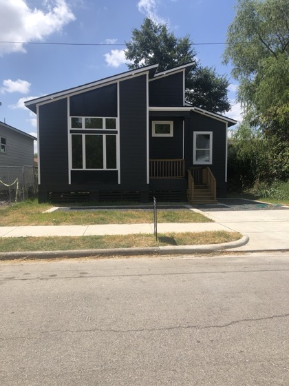 Completed modern black home exterior — AttarCo Homes roofing & remodeling project, Houston TX