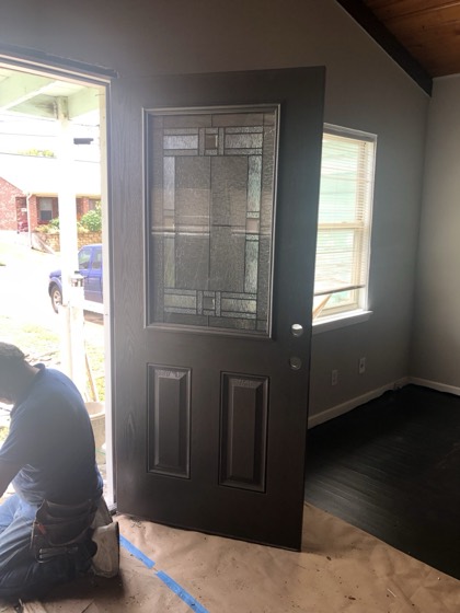 Decorative stained-glass entry door installed — AttarCo Homes roofing & remodeling project, Houston TX