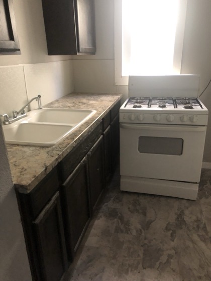 Finished kitchen with new counter and cabinets — AttarCo Homes roofing & remodeling project, Houston TX