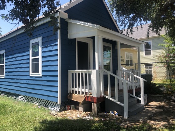 Finished navy porch and steps, angle view — AttarCo Homes roofing & remodeling project, Houston TX