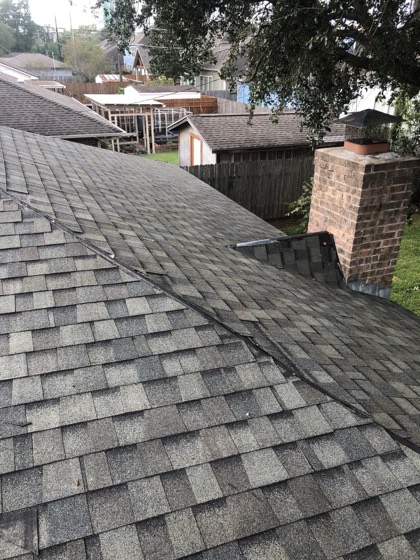 Finished shingle roof with brick chimney — AttarCo Homes roofing & remodeling project, Houston TX