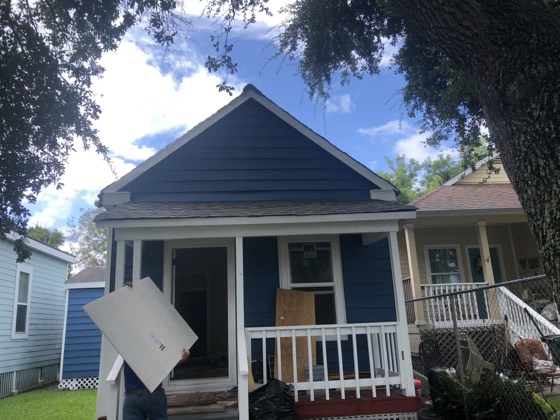Freshly painted blue craftsman home exterior — AttarCo Homes roofing & remodeling project, Houston TX