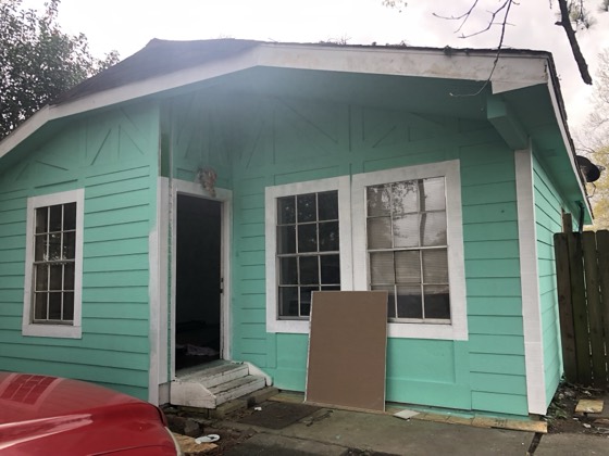 Freshly painted mint-green house exterior, front view — AttarCo Homes roofing & remodeling project, Houston TX