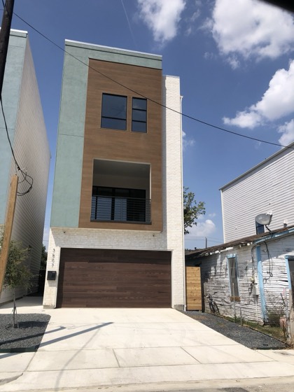 Modern three-story townhome, finished exterior — AttarCo Homes roofing & remodeling project, Houston TX
