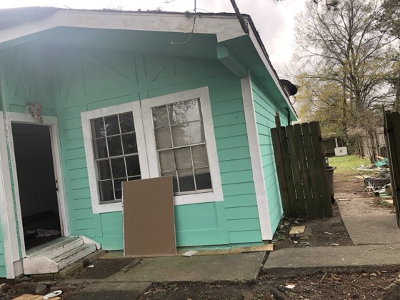 Repainted house exterior, corner and gable view — AttarCo Homes roofing & remodeling project, Houston TX